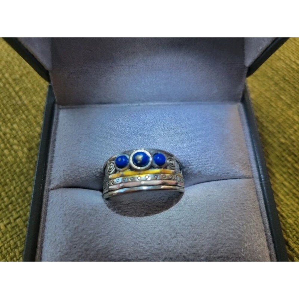 Silver and Gold Collored Ring With Blue Stones